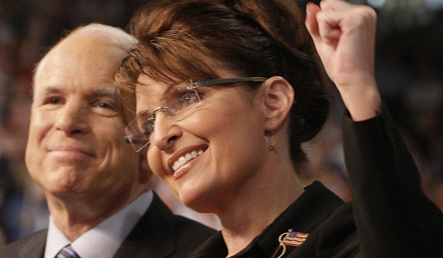 Republican presidential nominee Sen. John McCain, left, smiles as his Vice Presidential running mate, Alaska Gov. Sarah Palin, pumps her fist as she is introduced to supporters at a campaign rally in Dayton, Ohio, on Aug. 29, 2008. Palin re-emerged in Alaska politics over a decade after resigning as governor with hopes of winning the state's U.S. House seat. But she struggled to catch fire with voters and ran what critics saw as a lackluster campaign against a breakout Democrat who pitched herself as a regular Alaskan and a Republican backed by state GOP leaders. (AP Photo/Stephan Savoia, File)
