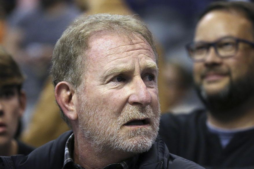 FILE - Phoenix Suns owner Robert Sarver watches the team play against the Memphis Grizzlies during the second half of an NBA basketball game Dec. 11, 2019, in Phoenix.Sarver has put his teams, the NBA’s Phoenix Suns and the WNBA’s Phoenix Mercury, on the market after an investigation found evidence of a racially and sexually insensitive workplace. (AP Photo/Ross D. Franklin, File)