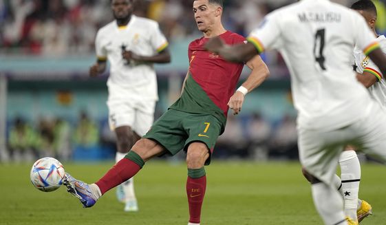 Portugal&#39;s Cristiano Ronaldo controls the ball during the World Cup group H soccer match between Portugal and Ghana, at the Stadium 974 in Doha, Qatar, Thursday, Nov. 24, 2022. (AP Photo/Ariel Schalit)