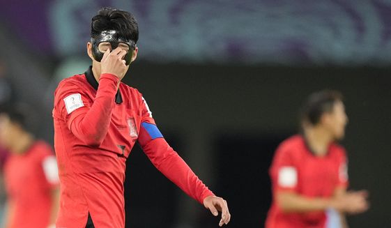 South Korea&#39;s Son Heung-min reacts during the World Cup group H soccer match between Uruguay and South Korea, at the Education City Stadium in Al Rayyan , Qatar, Thursday, Nov. 24, 2022. (AP Photo/Martin Meissner)