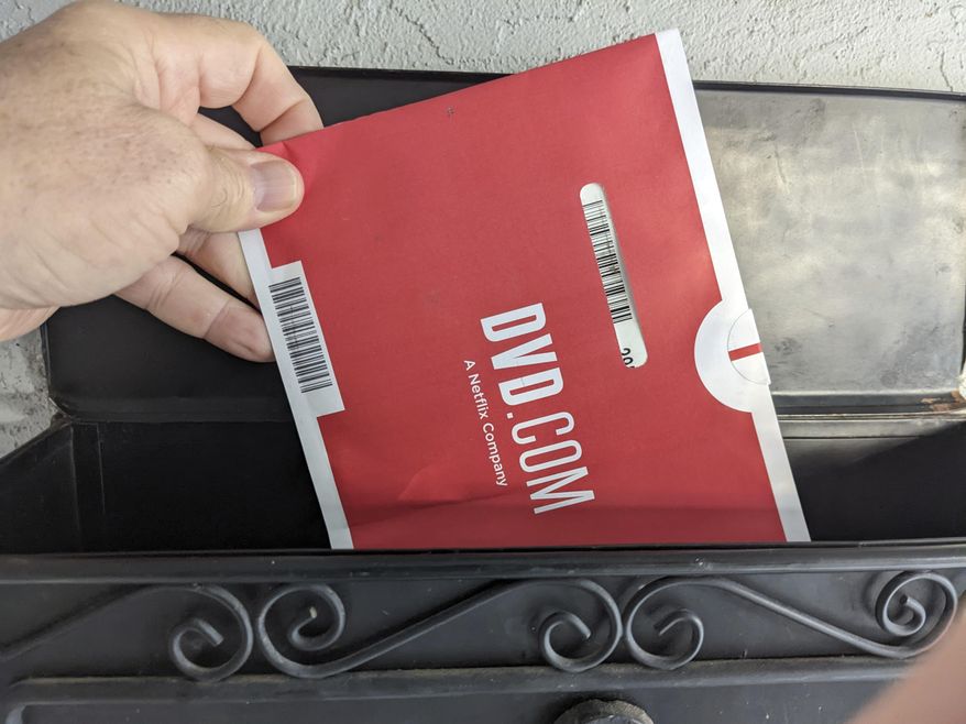 A Netflix DVD envelope is shown on Nov. 17, 2022 in San Francisco.  Subscribers to Netflix’s DVD-by-mail service still look forward to opening up their mailbox and finding one of the discs delivered in the familiar red-and-white envelopes.  (AP Photo/Michael Liedtke)