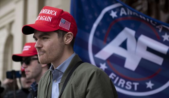 Nick Fuentes, far-right activist, holds a rally at the Lansing Capitol, in Lansing, Mich., Nov. 11, 2020. Former President Donald Trump had dinner Tuesday, Nov. 22, 2022, at his Mar-a-Lago club with the rapper formerly known as Kanye West, who is now known as Ye, as well as Nick Fuentes, who has used his online platform to spew antisemitic and White supremacist rhetoric. (Nicole Hester/Ann Arbor News via AP, File)