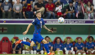 Christian Pulisic of the United States during the World Cup group B soccer match between England and The United States, at the Al Bayt Stadium in Al Khor , Qatar, Friday, Nov. 25, 2022. (AP Photo/Julio Cortez)