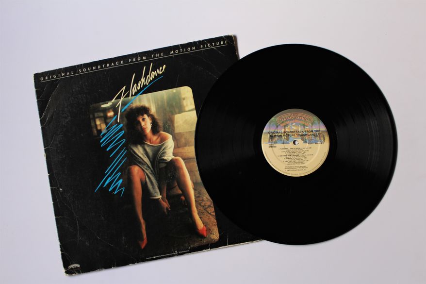 Miami, Fl, USA: Feb 21, 2021: Flashdance movie Original Soundtrack from the Motion Picture on vinyl record LP disc album. Album cover. Photo credit: Bluee77 via Shutterstock.
