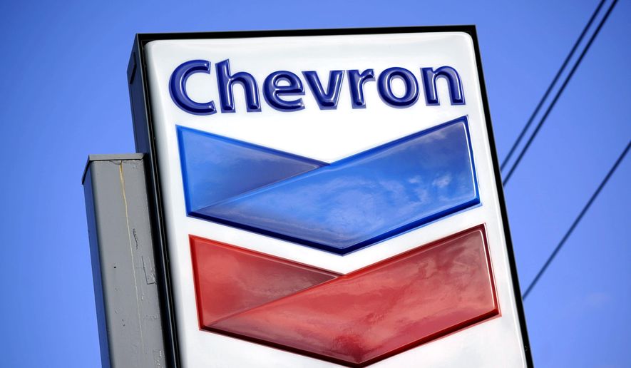 A Chevron sign is displayed outside one of the company&#39;s gas stations in Bradenton, Fla., Feb. 22, 2022. The Biden administration is easing some oil sanctions on Venezuela in an effort to support newly restarted negotiations between the Venezuelan government and its opposition. The Treasury Department is allowing Chevron to resume “limited” energy production in Venezuela after years of sanctions that have dramatically curtailed oil and gas profits that have flowed to President Nicolás Maduro’s government. (AP Photo/Gene J. Puskar, File)