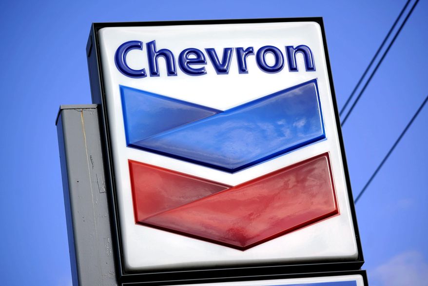 A Chevron sign is displayed outside one of the company&#x27;s gas stations in Bradenton, Fla., Feb. 22, 2022. The Biden administration is easing some oil sanctions on Venezuela in an effort to support newly restarted negotiations between the Venezuelan government and its opposition. The Treasury Department is allowing Chevron to resume “limited” energy production in Venezuela after years of sanctions that have dramatically curtailed oil and gas profits that have flowed to President Nicolás Maduro’s government. (AP Photo/Gene J. Puskar, File)