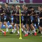 German players warm up during a training session at the Al-Shamal stadium on the eve of the group E World Cup soccer match between Germany and Spain, in Al-Ruwais, Qatar, Friday, Nov. 25, 2022. Germany will play the second match against Spain on Sunday, Nov. 27. (AP Photo/Matthias Schrader)