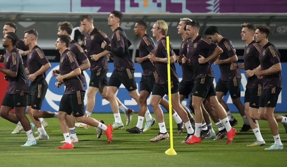 German players warm up during a training session at the Al-Shamal stadium on the eve of the group E World Cup soccer match between Germany and Spain, in Al-Ruwais, Qatar, Friday, Nov. 25, 2022. Germany will play the second match against Spain on Sunday, Nov. 27. (AP Photo/Matthias Schrader)