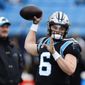 Carolina Panthers quarterback Baker Mayfield warms up before an NFL football game between the Carolina Panthers and the Denver Broncos on Sunday, Nov. 27, 2022, in Charlotte, N.C. (AP Photo/Jacob Kupferman)