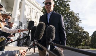 President Joe Biden talks to reporters before boarding Marine One on the South Lawn of the White House, Wednesday, Oct. 12, 2022, in Washington.  (AP Photo/Evan Vucci)