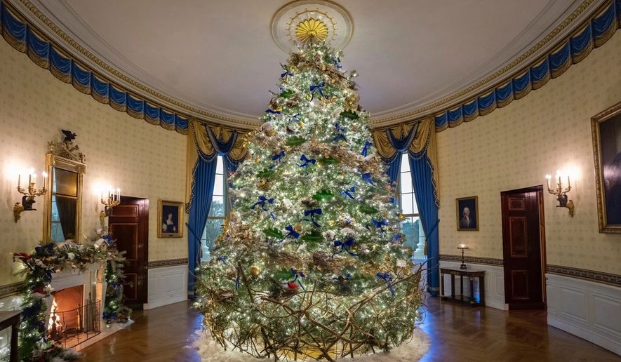 Depictions of the official birds from all 57 states, territories and the District of Columbia sit on the main Christmas tree in the White House&#39;s Blue Room. This 2022 theme is &quot;We the People.&quot; (Image: https://www.whitehouse.gov/holidays-2022/)