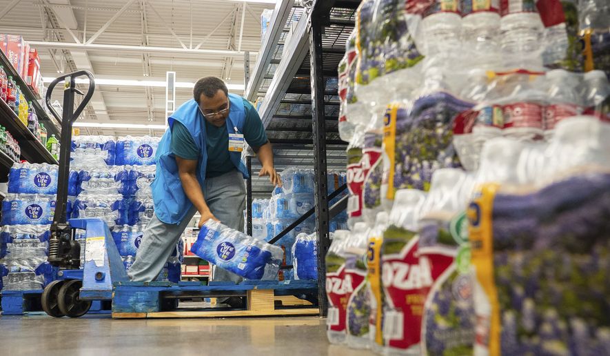Water is stocked at Walmart after a boil water notice was issued for the entire city of Houston on Sunday, Nov. 27, 2022, at Walmart on S. Post Oak Road in Houston. (Mark Mulligan/Houston Chronicle via AP)