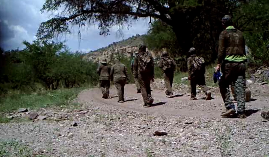 People in camouflage walk through Arizona from the southern U.S. border. Screenshot of video provided by Jim Chilton’s ranch in Arivaca, Arizona.