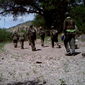 People in camouflage walk through Arizona from the southern U.S. border. Screenshot of video provided by Jim Chilton’s ranch in Arivaca, Arizona.