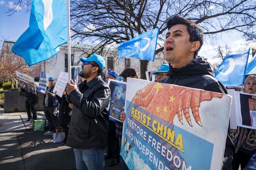 Amanalla Kashgari, of Ashburn Va., with the East Turkistan Youth Congress, protests against China and in support of the Uyghur people, in the wake of the Urumqi fire in China, Monday, Nov. 28, 2022, outside the State Department in Washington. (AP Photo/Jacquelyn Martin)