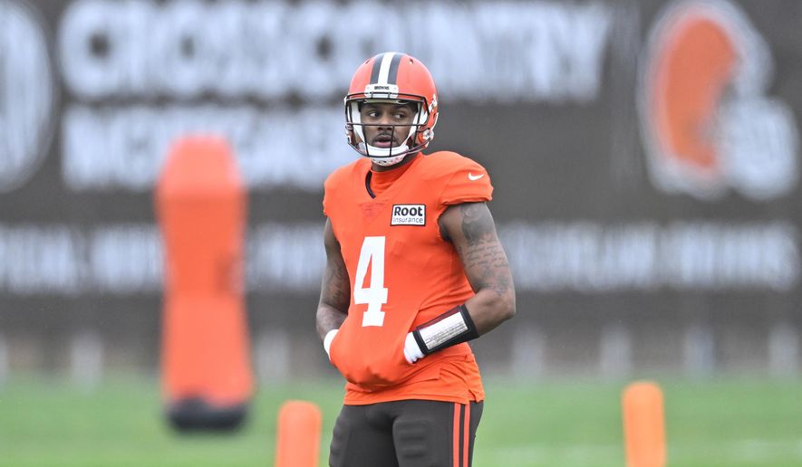 Cleveland Browns quarterback Deshaun Watson stands on the field during an NFL football practice at the team&#x27;s training facility Wednesday, Nov. 16, 2022, in Berea, Ohio. (AP Photo/David Richard)