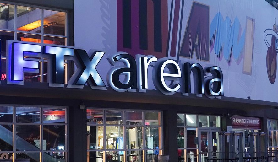 Signage for the FTX Arena, where the Miami Heat basketball team plays, is illuminated Saturday, Nov. 12, 2022, in Miami. Collapsed cryptocurrency trading firm FTX confirmed there was “unauthorized access” to its accounts, hours after the company filed for Chapter 11 bankruptcy protection Friday, Nov. 11. (AP Photo/Marta Lavandier)
