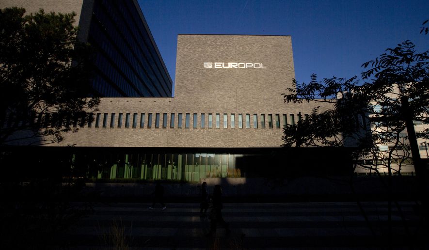 This Wednesday, Oct. 10, 2018, file photo shows the sun bouncing off the Europol headquarters in The Hague, Netherlands. Europol says law enforcement authorities in six different countries have joined forces to take down a “super cartel” of drugs traffickers controlling about one third of the cocaine trade in Europe. (AP Photo/Peter Dejong, File)
