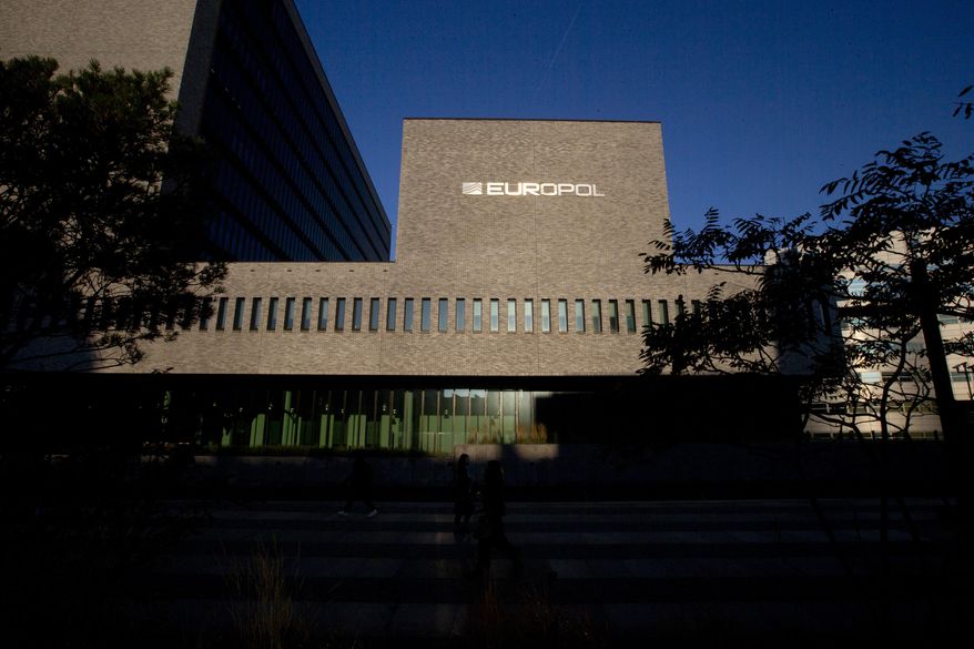 This Wednesday, Oct. 10, 2018, file photo shows the sun bouncing off the Europol headquarters in The Hague, Netherlands. Europol says law enforcement authorities in six different countries have joined forces to take down a “super cartel” of drugs traffickers controlling about one third of the cocaine trade in Europe. (AP Photo/Peter Dejong, File)
