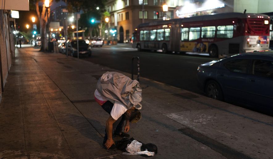 Anthony Delio, 36, falls asleep on a sidewalk after smoking fentanyl in Los Angeles, Tuesday, Aug. 23, 2022. Use of fentanyl, a powerful synthetic opioid that is cheap to produce and is often sold as is or laced in other drugs, has exploded. Because it&#x27;s 50 times more potent than heroin, even a small dose can be fatal. It has quickly become the deadliest drug in the nation, according to the Drug Enforcement Administration. Two-thirds of the 107,000 overdose deaths in 2021 were attributed to synthetic opioids like fentanyl, the U.S. Centers for Disease Control and Prevention says. (AP Photo/Jae C. Hong) **FILE**