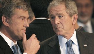 Ukraine&#39;s President Viktor Yushchenko talks with US President George W. Bush, at the NATO Summit conference in Bucharest, Thursday April 3, 2008. NATO returns on Tuesday, Nov. 29, 2022 to the scene of one of its most controversial decisions and where it intends to repeat its vow that Ukraine, now suffering through the tenth month of a war against Russia, will be able to join the world&#39;s biggest military alliance one day.(AP Photo/Vadim Ghirda, File)