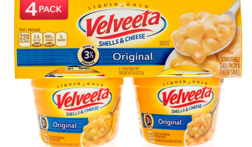 A package of Velveeta shells and cheese four pack sits in Winneconne, Wis. Sept. 29, 2018. The Kraft Heinz Foods Co. is being sued for $5 million for the &quot;false and misleading&quot; claim that its microwavable Velveeta Shells &amp; Cheese is &quot;ready in 3 1/2 minutes&quot; as it states on its packaging, according to court records. (File Photo credit: Keith Homan via Shutterstock)