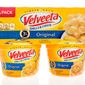 A package of Velveeta shells and cheese four pack sits in Winneconne, Wis. Sept. 29, 2018. The Kraft Heinz Foods Co. is being sued for $5 million for the &quot;false and misleading&quot; claim that its microwavable Velveeta Shells &amp; Cheese is &quot;ready in 3 1/2 minutes&quot; as it states on its packaging, according to court records. (File Photo credit: Keith Homan via Shutterstock)