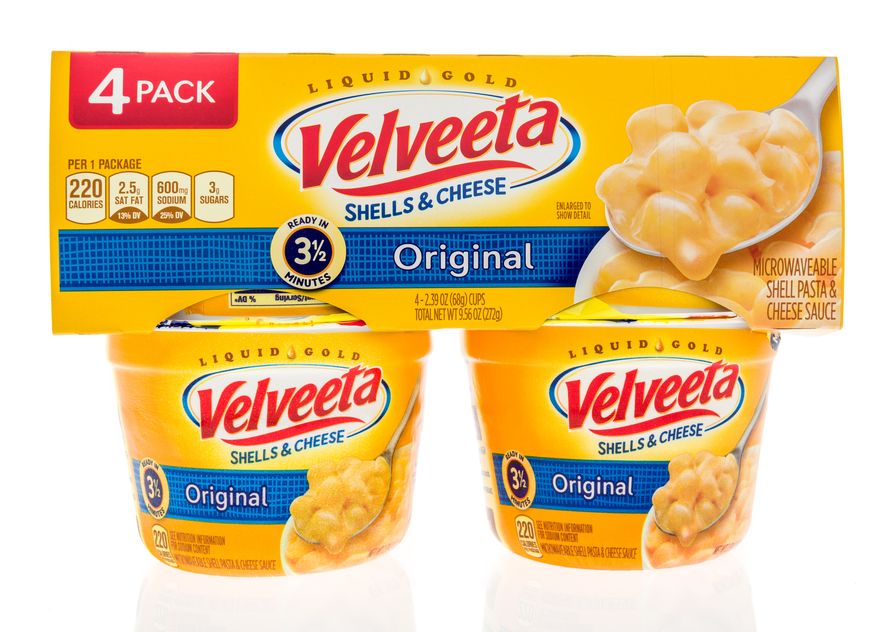 A package of Velveeta shells and cheese four pack sits in Winneconne, Wis. Sept. 29, 2018. The Kraft Heinz Foods Co. is being sued for $5 million for the "false and misleading" claim that its microwavable Velveeta Shells & Cheese is "ready in 3 1/2 minutes" as it states on its packaging, according to court records. (File Photo credit: Keith Homan via Shutterstock)