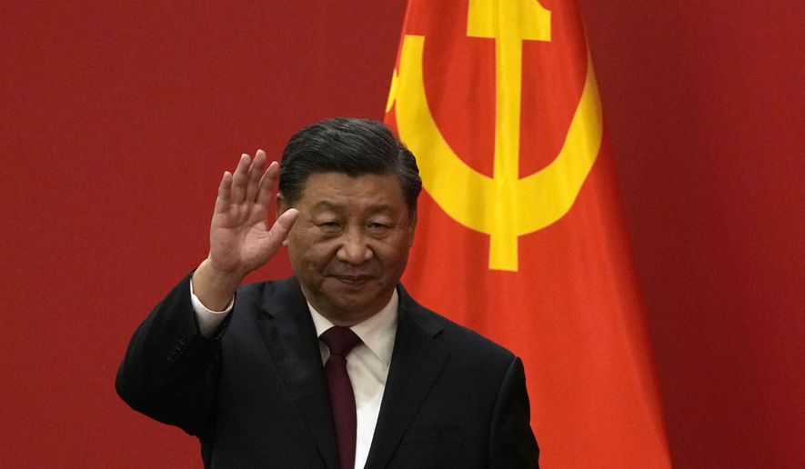 Chinese President Xi Jinping waves at an event to introduce new members of the Politburo Standing Committee at the Great Hall of the People in Beijing on Oct. 23, 2022.  Barely a month after granting himself new powers as China’s possible leader for life, Xi is facing a wave of public anger of the kind not seen for decades, sparked by his draconian “zero-COVID” program that will soon enter its fourth year. (AP Photo/Andy Wong, File)