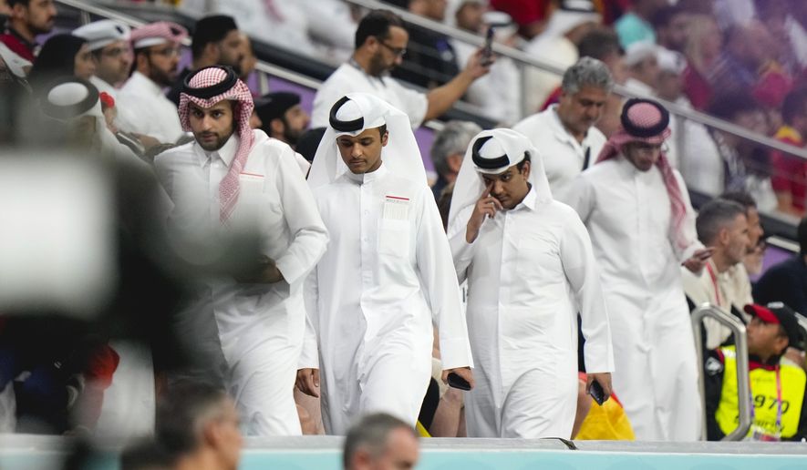 Spectators leave the stands before the end of the second half of the World Cup group E soccer match between Spain and Germany, at the Al Bayt Stadium in Al Khor , Qatar, Sunday, Nov. 27, 2022. (AP Photo/Luca Bruno)