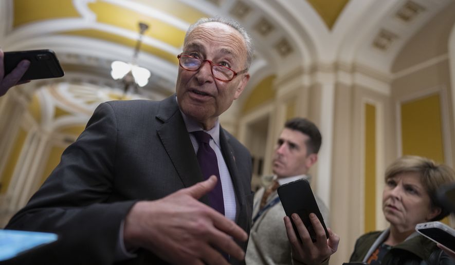 Senate Majority Leader Chuck Schumer, D-N.Y., briefs reporters as he returns from a White House meeting with President Joe Biden and other congressional leaders, at the Capitol in Washington, Tuesday, Nov. 29, 2022. Biden is looking to ensure government funding and lock in more legislative wins before Democrats lose control of the House in January. (AP Photo/J. Scott Applewhite)