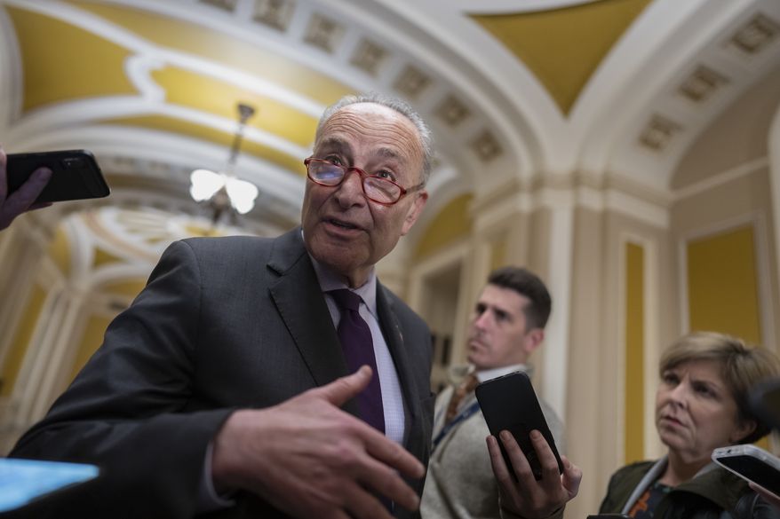 Senate Majority Leader Chuck Schumer, D-N.Y., briefs reporters as he returns from a White House meeting with President Joe Biden and other congressional leaders, at the Capitol in Washington, Tuesday, Nov. 29, 2022. Biden is looking to ensure government funding and lock in more legislative wins before Democrats lose control of the House in January. (AP Photo/J. Scott Applewhite)
