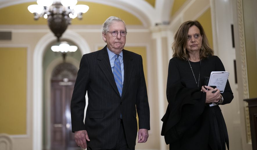 Senate Minority Leader Mitch McConnell, R-Ky., joined at right by Sharon Soderstrom, his chief of staff, returns from a meeting of congressional leaders with President Joe Biden at the White House, at the Capitol in Washington, Tuesday, Nov. 29, 2022. (AP Photo/J. Scott Applewhite)