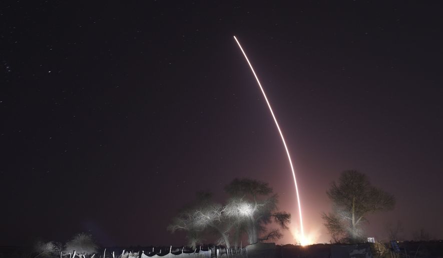 In this photo released by Xinhua News Agency, the light trail of the launched manned spaceship Shenzhou-15, atop the Long March-2F Y15 carrier rocket after it blasted off from the Jiuquan Satellite Launch Center in northwestern China on Tuesday, Nov. 29, 2022. China launched the rocket Tuesday carrying three astronauts to complete construction of the country&#39;s permanent orbiting space station. (Ren Junchuan/Xinhua via AP)