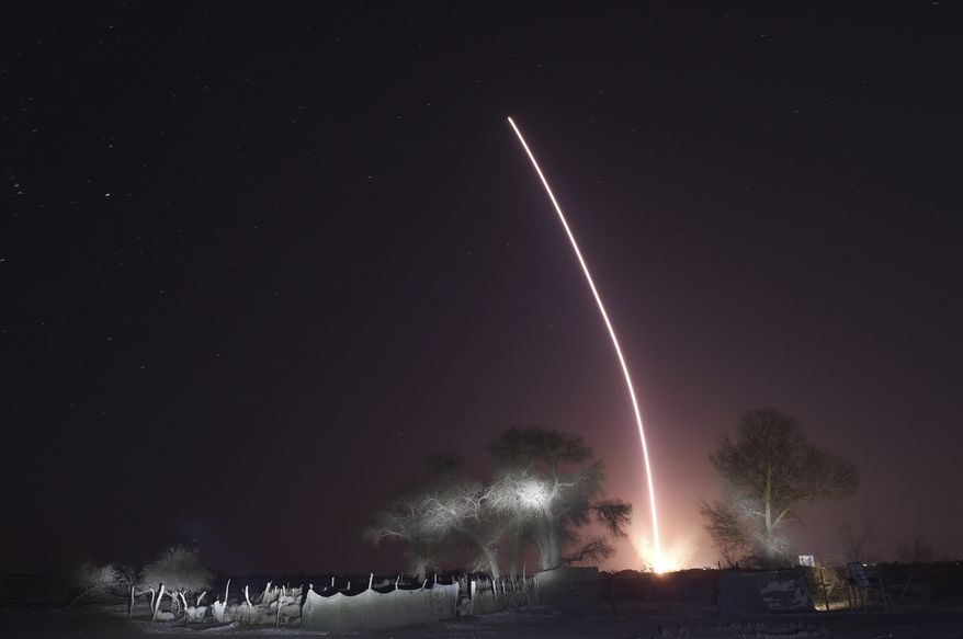 In this photo released by Xinhua News Agency, the light trail of the launched manned spaceship Shenzhou-15, atop the Long March-2F Y15 carrier rocket after it blasted off from the Jiuquan Satellite Launch Center in northwestern China on Tuesday, Nov. 29, 2022. China launched the rocket Tuesday carrying three astronauts to complete construction of the country&#x27;s permanent orbiting space station. (Ren Junchuan/Xinhua via AP)