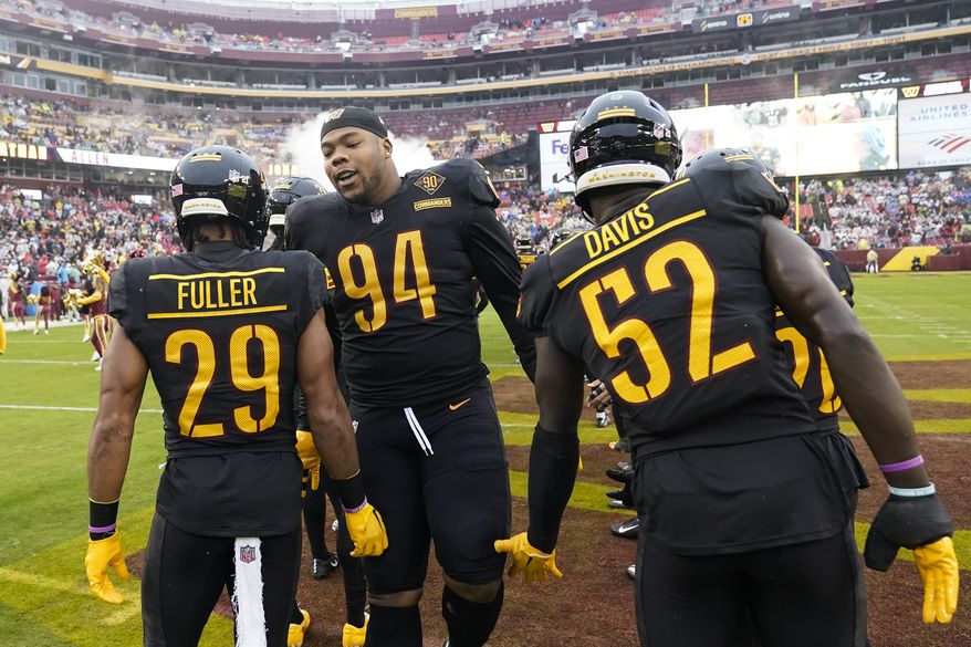 Washington Commanders defensive tackle Daron Payne (94) is introduced before an NFL football game against the Atlanta Falcons Sunday, Nov. 27, 2022, in Landover, Md. (AP Photo/Alex Brandon)