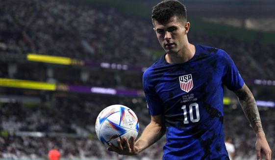 Christian Pulisic of the United States carries a ball during the World Cup group B soccer match between Iran and the United States at the Al Thumama Stadium in Doha, Qatar, Tuesday, Nov. 29, 2022. (AP Photo/Manu Fernandez)