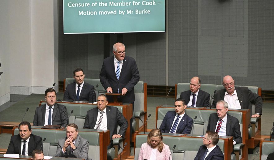 Former Australian Prime Minister Scott Morrison, standing at rear, speaks during a censure motion against him in the House of Representatives at Parliament House in Canberra, Australia, Wednesday, Nov. 30, 2022. Morrison has listed his achievements in government including standing up to a &amp;quot;bullying&amp;quot; China as he unsuccessfully argued against being censured by the Parliament for secretly amassing multiple ministerial powers. (Mick Tsikas/AAP Image via AP)