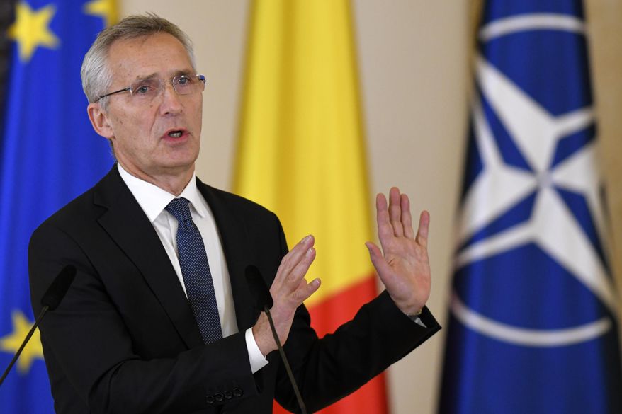 NATO Secretary-General Jens Stoltenberg gestures during joint statements with Romanian President Klaus Iohannis in Bucharest, Romania, Monday, Nov. 28, 2022, a day before the start of the meeting of NATO Foreign Ministers. NATO returns to the scene of one of its most controversial decisions and where it intends to repeat its vow that Ukraine, now suffering through the 10th month of a war against Russia, will be able to join the world&#x27;s biggest military alliance one day. (AP Photo/Alexandru Dobre)