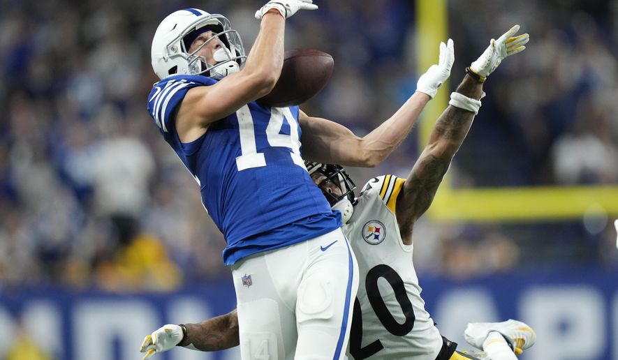 Indianapolis Colts&#x27; Alec Pierce (14) cannot make a catch against Pittsburgh Steelers&#x27; Cameron Sutton (20) during the second half of an NFL football game, Monday, Nov. 28, 2022, in Indianapolis. (AP Photo/AJ Mast)
