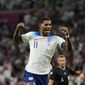 England&#39;s Marcus Rashford celebrates after scoring his side&#39;s third goal during the World Cup group B soccer match between England and Wales, at the Ahmad Bin Ali Stadium in Al Rayyan , Qatar, Tuesday, Nov. 29, 2022. (AP Photo/Frank Augstein)