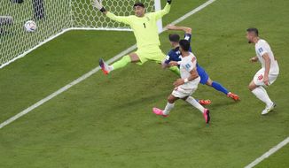Christian Pulisic of the United States scores his side&#39;s opening goal during the World Cup group B soccer match between Iran and the United States at the Al Thumama Stadium in Doha, Qatar, Tuesday, Nov. 29, 2022. (AP Photo/Luca Bruno)
