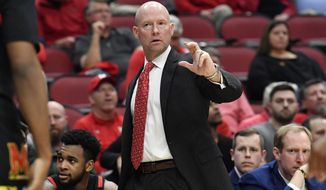 Maryland head coach Kevin Willard signals a play in to his team during the second half of an NCAA college basketball game against Louisville in Louisville, Ky., Tuesday, Nov. 29, 2022. Maryland won 79-54. (AP Photo/Timothy D. Easley)