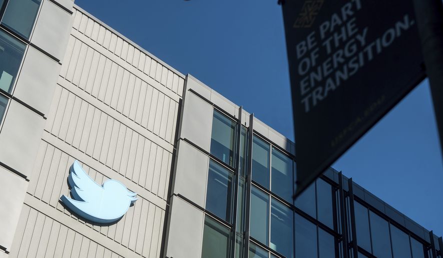 A Twitter logo hangs outside the company&#x27;s San Francisco offices on Nov. 1, 2022. A top European Union official warned Elon Musk on Wednesday, Nov. 30, 2022, that Twitter needs to beef up measures to protect users from hate speech, misinformation and other harmful content to avoid violating new rules that threaten tech giants with big fines or even a ban in the 27-nation bloc. (AP Photo/Noah Berger)