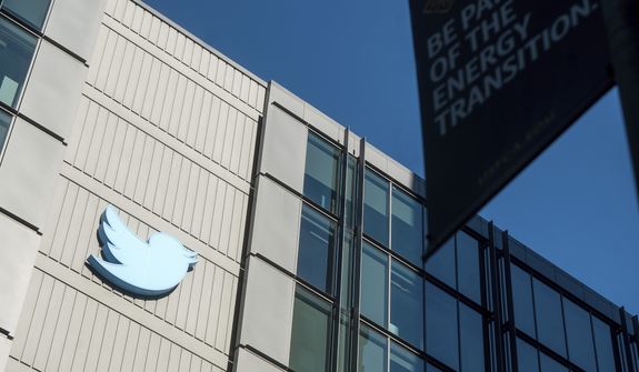 A Twitter logo hangs outside the company&#39;s San Francisco offices on Nov. 1, 2022. A top European Union official warned Elon Musk on Wednesday, Nov. 30, 2022, that Twitter needs to beef up measures to protect users from hate speech, misinformation and other harmful content to avoid violating new rules that threaten tech giants with big fines or even a ban in the 27-nation bloc. (AP Photo/Noah Berger)