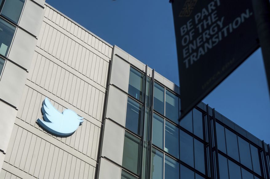 A Twitter logo hangs outside the company&#x27;s San Francisco offices on Nov. 1, 2022. A top European Union official warned Elon Musk on Wednesday, Nov. 30, 2022, that Twitter needs to beef up measures to protect users from hate speech, misinformation and other harmful content to avoid violating new rules that threaten tech giants with big fines or even a ban in the 27-nation bloc. (AP Photo/Noah Berger)