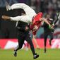 A pitch invader jumps during a World Cup group D soccer match between Tunisia and France at the Education City Stadium in Al Rayyan, Qatar, Wednesday, Nov. 30, 2022. (AP Photo/Martin Meissner)