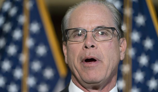 FILE - U.S. Sen. Mike Braun, R-Ind., speaks to reporters Feb., 2, 2022, on Capitol Hill in Washington. Braun said Wednesday, Nov. 16, 2022 that the long list of possible 2024 Republican candidates for governor will not sway his decision on whether to enter that race. (AP Photo/Jacquelyn Martin, File)