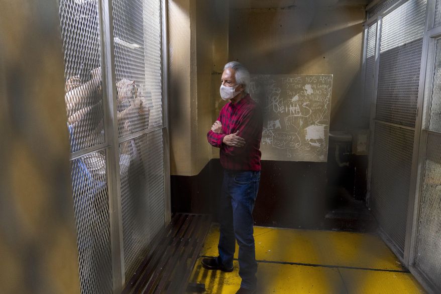 Award-winning journalist Jose Ruben Zamora, who was arrested the day before, stands inside a cell after a court hearing, in Guatemala City, Saturday, July 30, 2022. The prominent Guatemalan investigative newspaper “El Periodico” announced on Nov. 30, 2022 that it is stopping its print edition, after the government arrested Zamora, the paper’s president. (AP Photo/Moises Castillo, File)