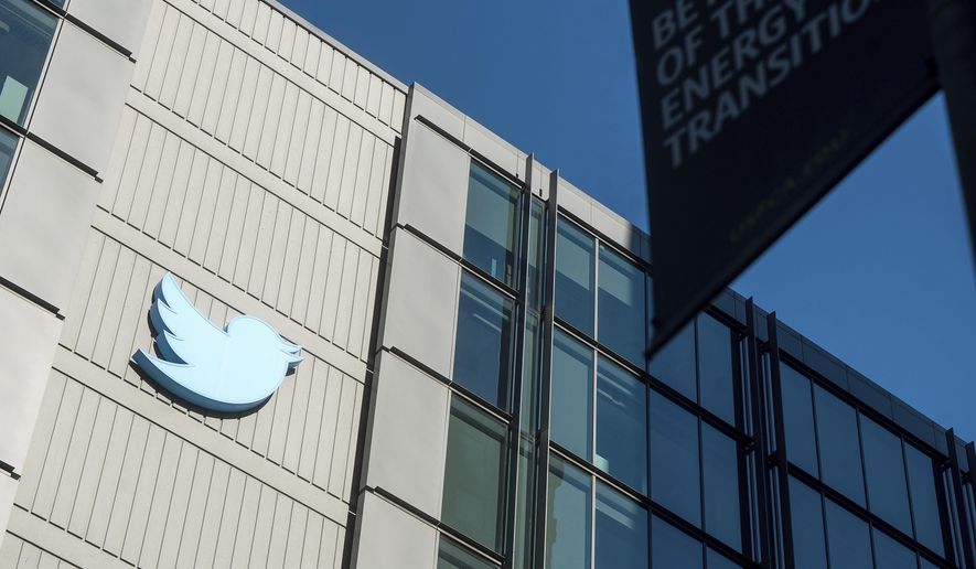 A Twitter logo hangs outside the company&#x27;s San Francisco offices on Nov. 1, 2022. (AP Photo/Noah Berger, File)